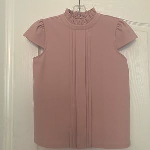 Powdery pink top from Ann Taylor. Small size. It was worn only once.